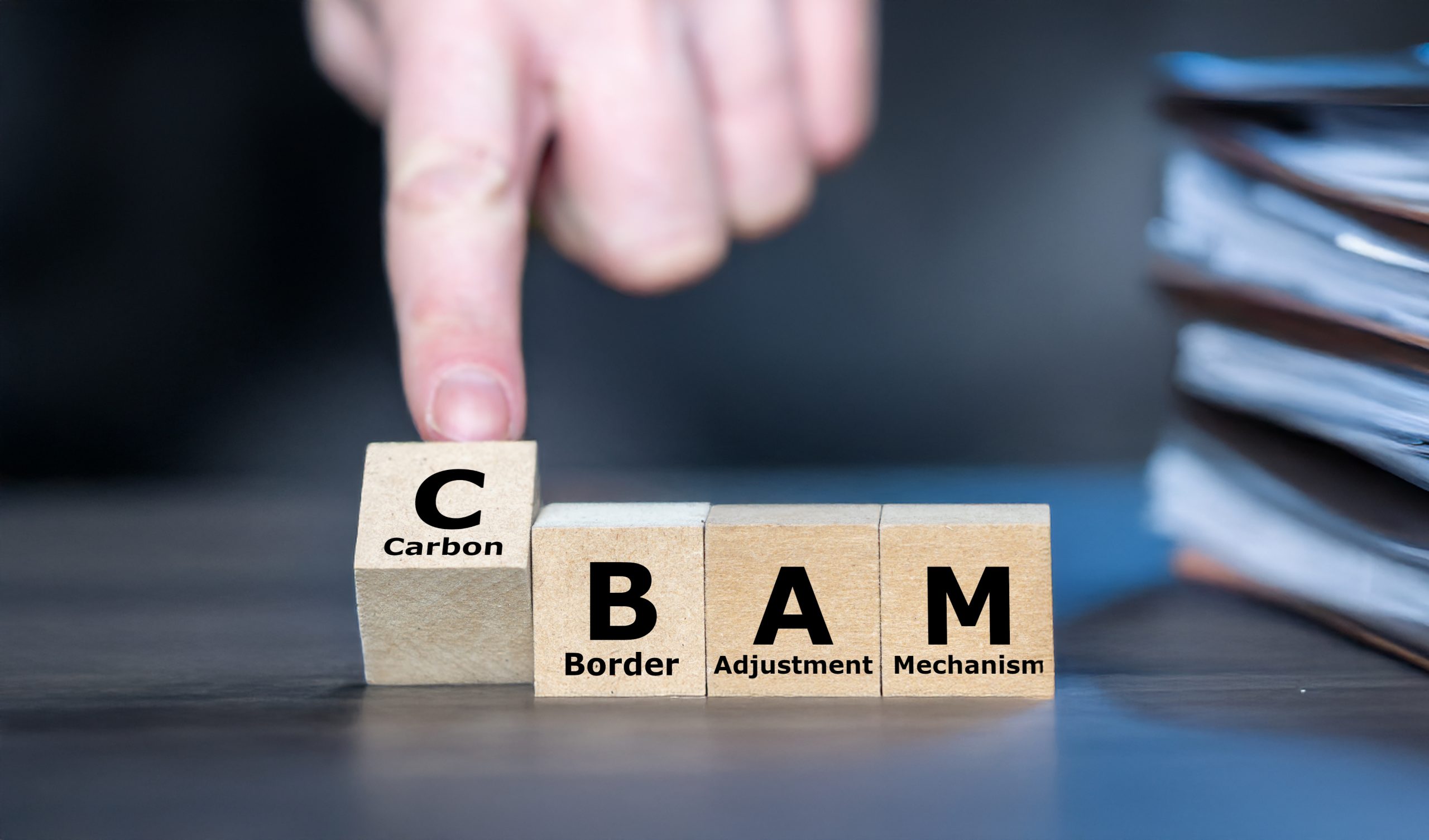 Stock photo of CBAM cubes symbolizing the EU’s Carbon Border Adjustment Mechanism, carbon pricing, and climate-aligned trade regulation.
